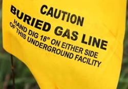 Yellow 811 flag to mark the location of an underground natural gas line