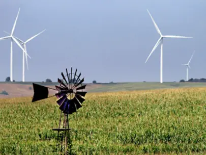 Iowa farmfield with windmill and wind turbines